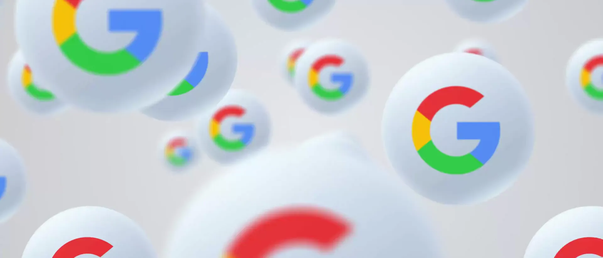 Google logos drifting across a light grey background